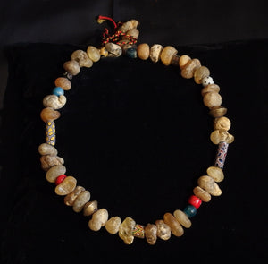 21 African amber and trade bead